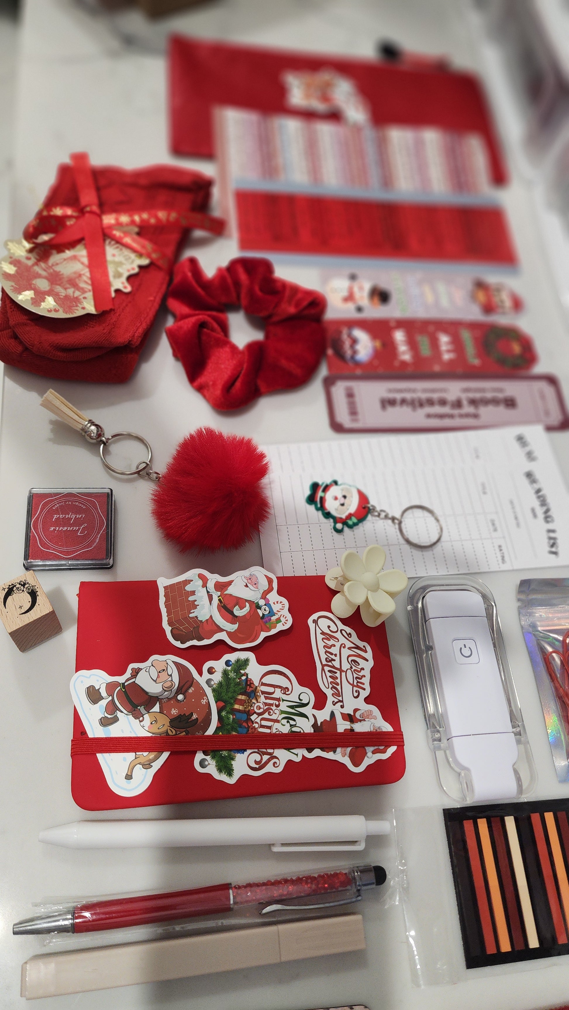 Collection of Christmas-themed stationery items on a white surface